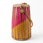 Traditional Folk Musical Instrument Mandar from Jharkhand featuring vibrant pink and yellow colors and leather straps, representing tribal culture and its new GI Tag.